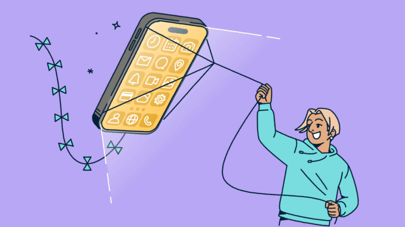 A person flying a mobile phone like a kite.
