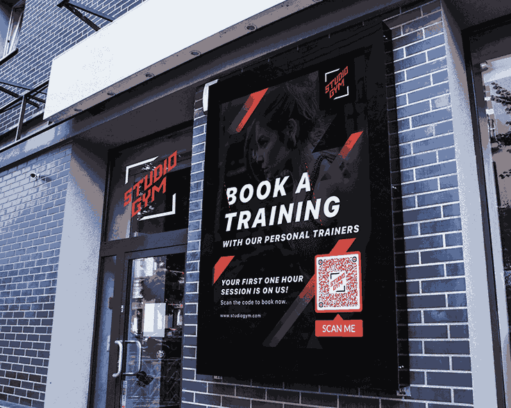 A black and orange poster with a QR Code on top of it next to Studio Gym’s glass door.